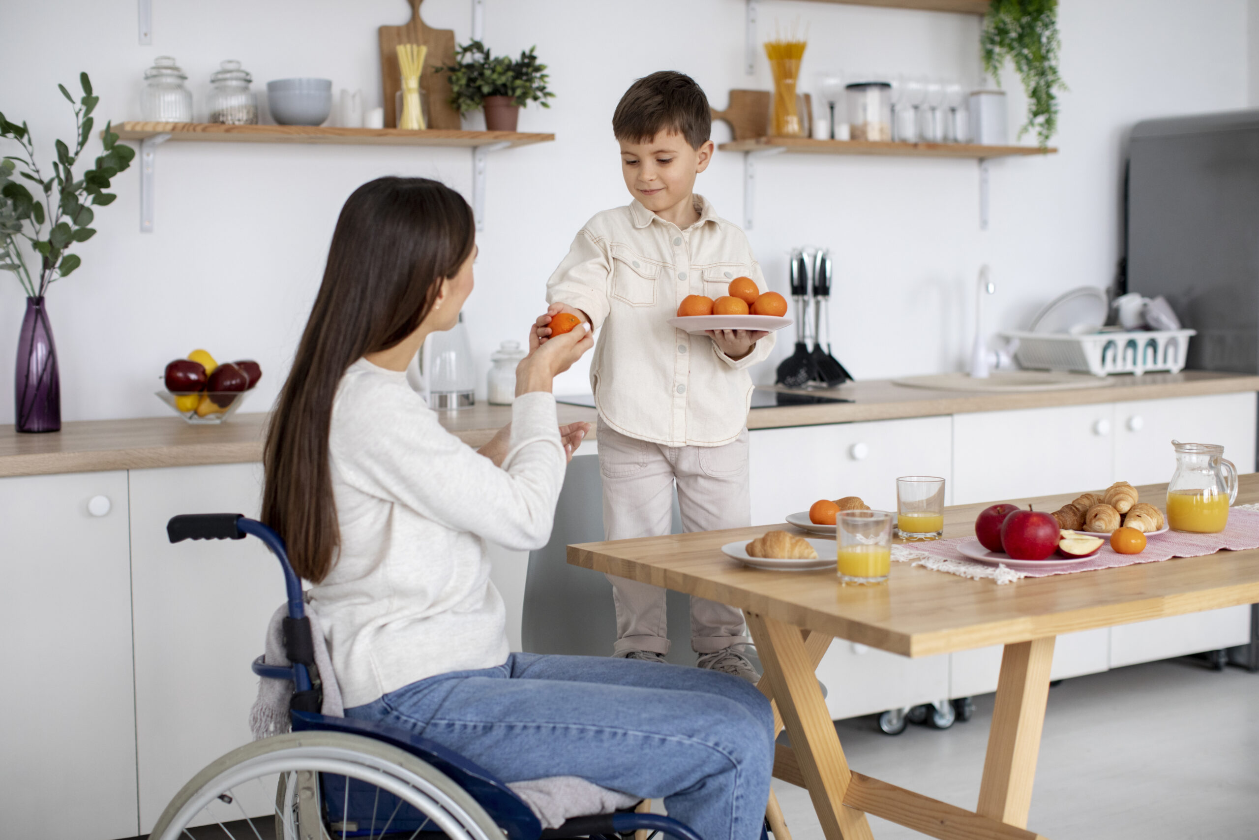 child helping his disabled mother